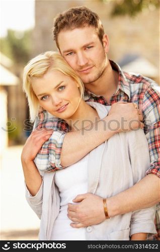 Portrait Of Romantic Young Couple Embracing