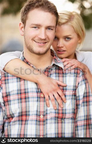 Portrait Of Romantic Young Couple Embracing