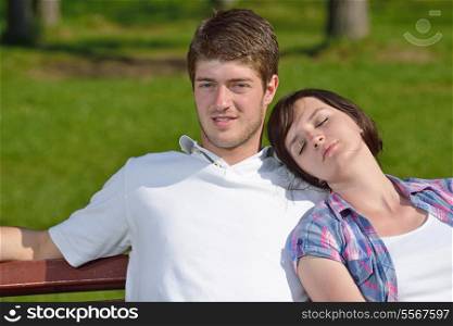 Portrait of romantic young couple in love smiling together outdoor in nature with blue sky in background