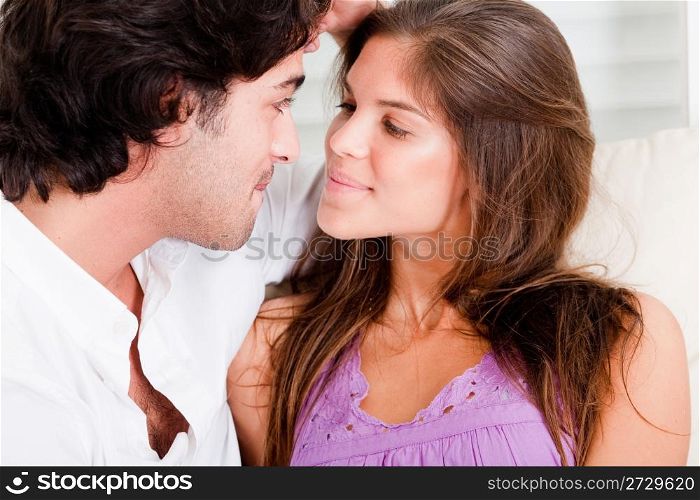 portrait of romantic young couple in passion look eachother in causel wear