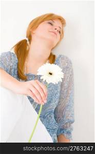 Portrait of romantic young woman hold gerbera daisy