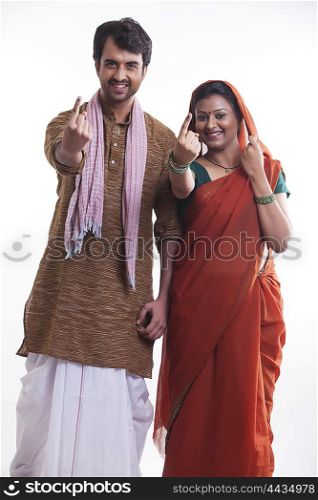 Portrait of rural couple with voters mark