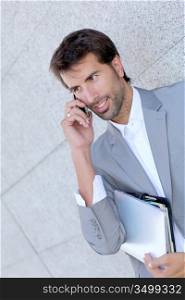 Portrait of salesman talking on mobile phone
