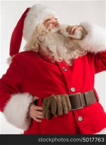 Portrait of Santa Claus Drinking milk from glass bottle. Greeting card background