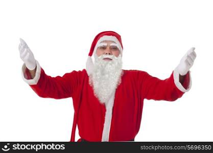 Portrait of Santa Claus with arms raised over white background