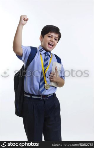 Portrait of school boy rejoicing
