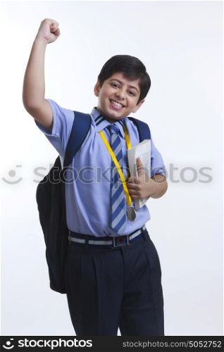 Portrait of school boy rejoicing