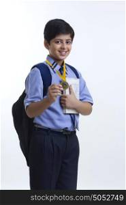 Portrait of school boy with medal