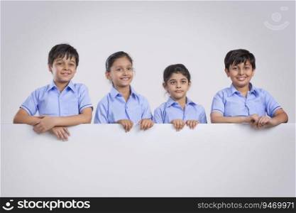 portrait of school children standing and smiling