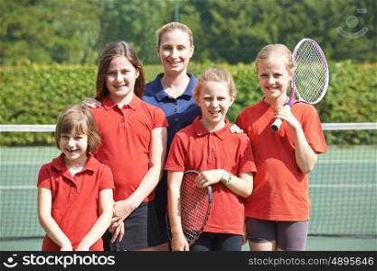 Portrait Of School Tennis Team With Teacher
