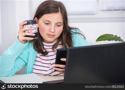 portrait of schoolgirl using phone