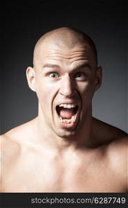 portrait of screaming man isolated on gray background