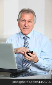 Portrait of senior businessman in office