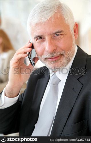 Portrait of senior businessman talking on the phone