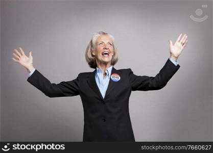 Portrait of senior businesswoman celebrating success