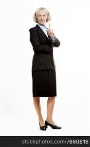 Portrait of senior businesswoman standing in suit 