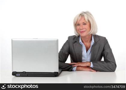 Portrait of senior businesswoman with laptop computer