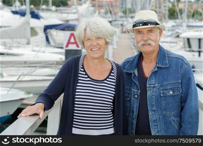 portrait of senior couple at a marina