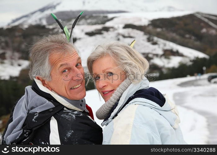 Portrait of senior couple in ski resort