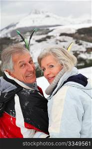 Portrait of senior couple in ski resort
