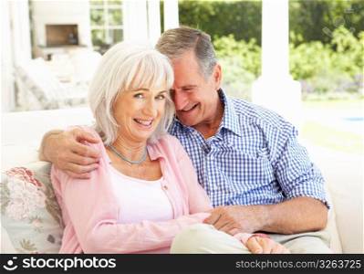 Portrait Of Senior Couple Relaxing Together On Sofa