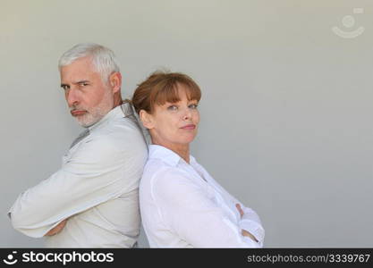 Portrait of senior couple upset at each other