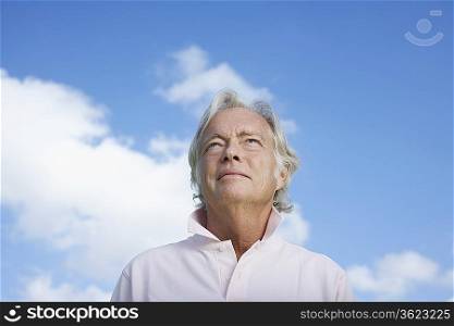 Portrait of senior man against sky