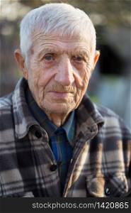 portrait of senior man close up outdoor