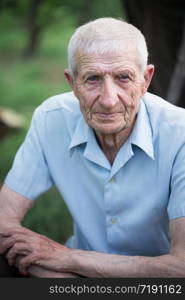 portrait of senior man close up outdoor