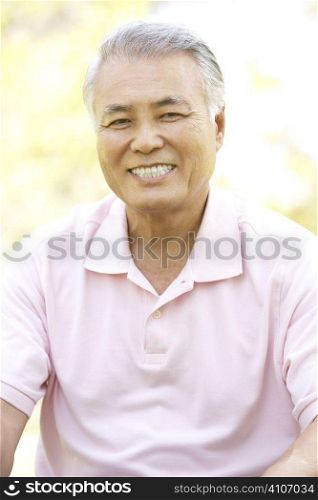 Portrait Of Senior Man In Park