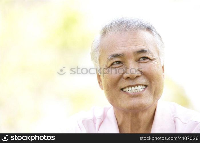 Portrait Of Senior Man In Park
