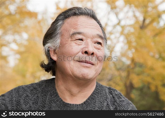 Portrait of senior man in park