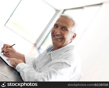 Portrait of senior man relaxing in sofa at home
