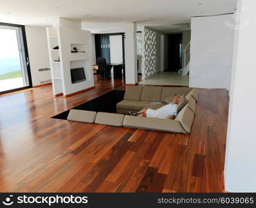 Portrait of senior man relaxing in sofa at home