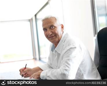 Portrait of senior man relaxing in sofa at home