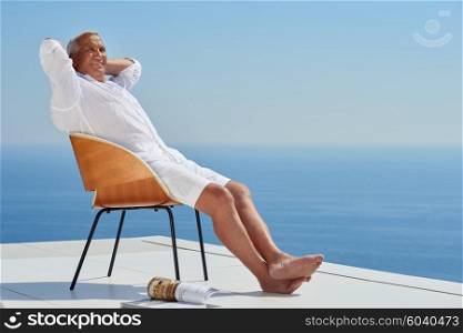 Portrait of senior man sitting outside