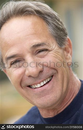 Portrait Of Senior Man Smiling At Camera