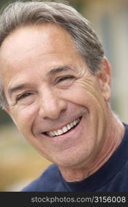 Portrait Of Senior Man Smiling At Camera