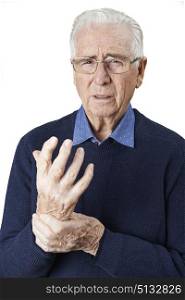 Portrait Of Senior Man Suffering With Arthritis
