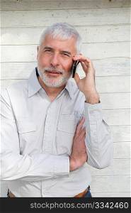 Portrait of senior man talking on the phone