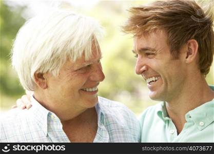 Portrait Of Senior Man Talking To Adult Son