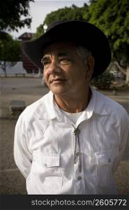 Portrait of senior man wearing hat, outdoor
