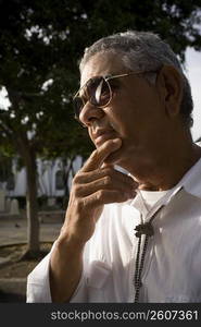 Portrait of senior man wearing sunglasses, outdoors