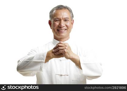 Portrait of senior man wearing Tai Chi clothes