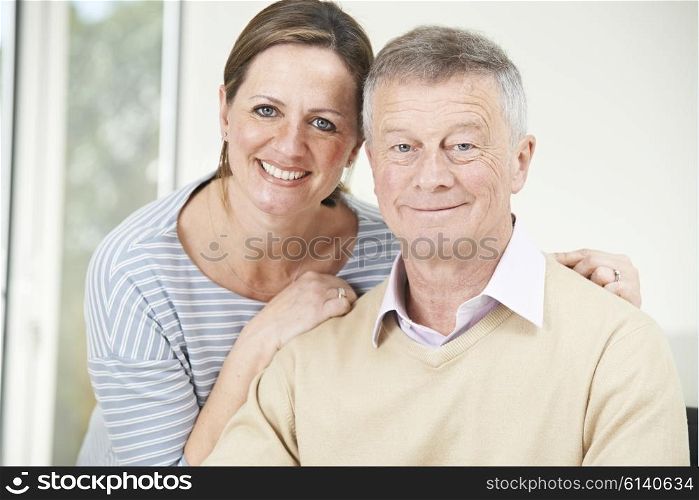 Portrait Of Senior Man With Adult Daughter