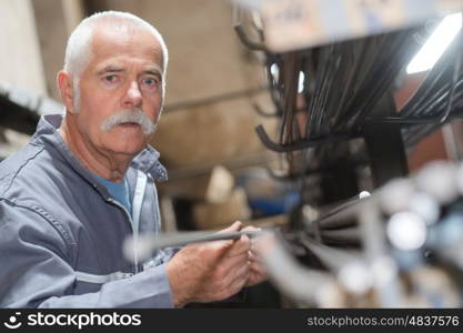 portrait of senior metallurgy worker