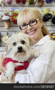 Portrait of senior pet owner shop with dog