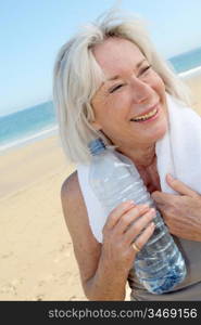 Portrait of senior woman drinking water