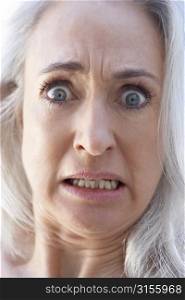 Portrait Of Senior Woman Looking Shocked