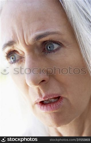 Portrait Of Senior Woman Looking Upset